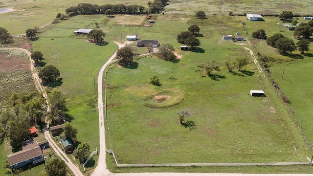 birds eye view of property featuring a rural view