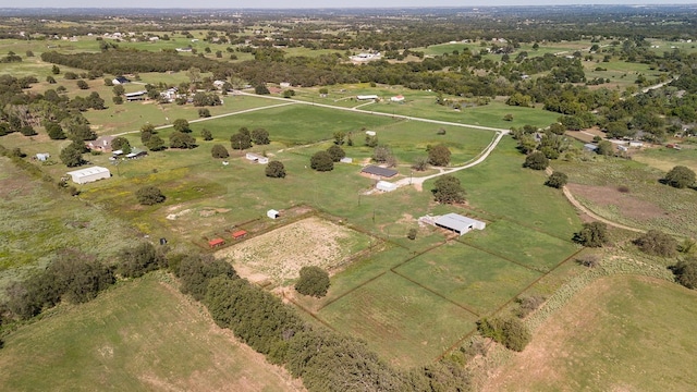 birds eye view of property with a rural view