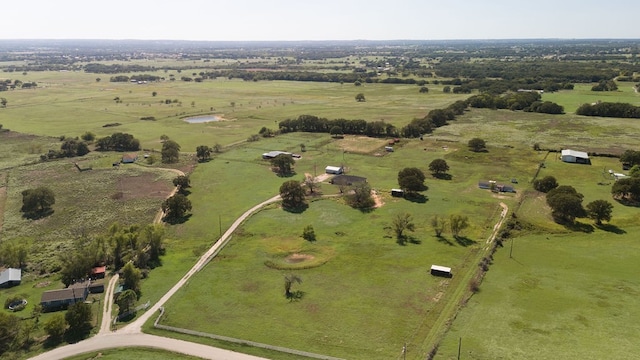 birds eye view of property featuring a rural view