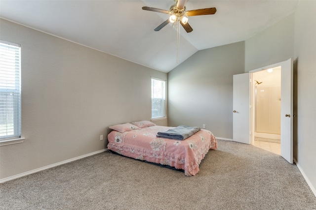 carpeted bedroom with vaulted ceiling and ceiling fan