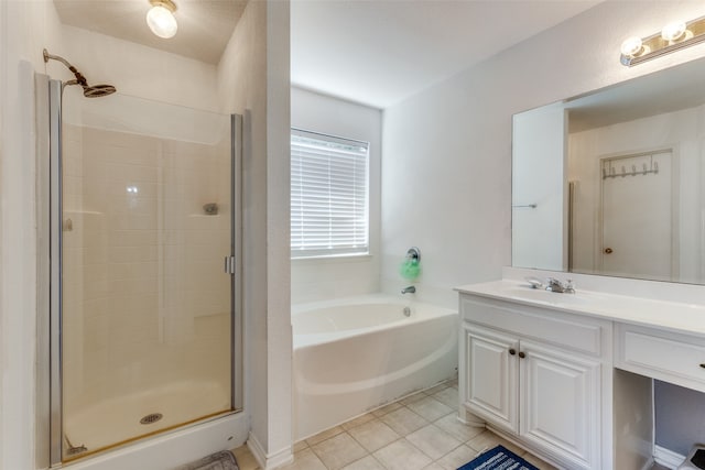 bathroom with vanity, shower with separate bathtub, and tile patterned floors