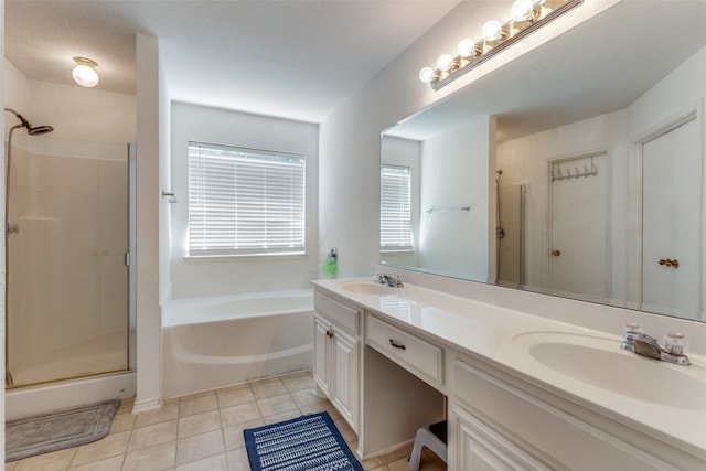 bathroom featuring tile patterned flooring, plenty of natural light, vanity, and independent shower and bath