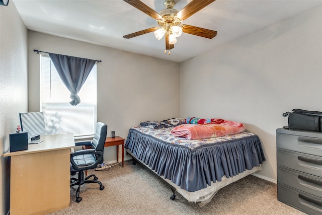 bedroom featuring ceiling fan and light colored carpet