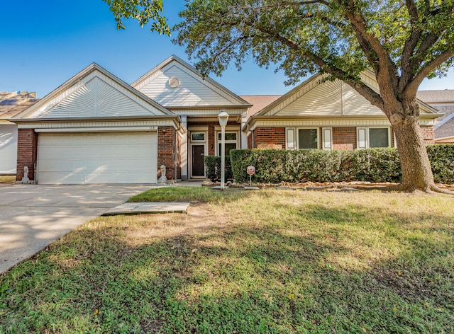 view of front of house with a front yard and a garage