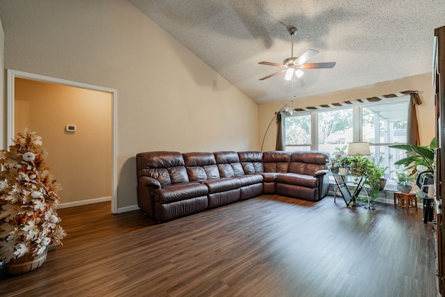 living room featuring high vaulted ceiling, ceiling fan, dark wood-type flooring, and a textured ceiling