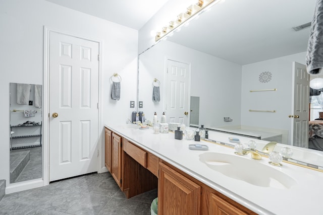 bathroom with vanity and tile patterned flooring