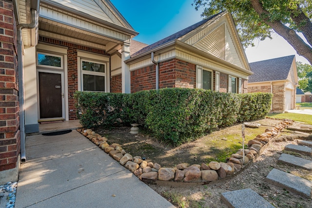 entrance to property featuring a garage