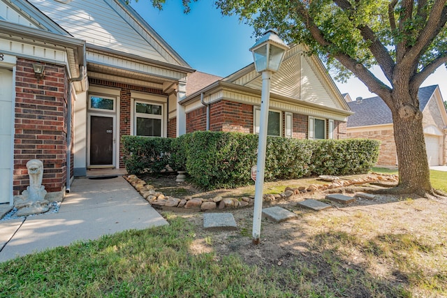 view of exterior entry with a garage