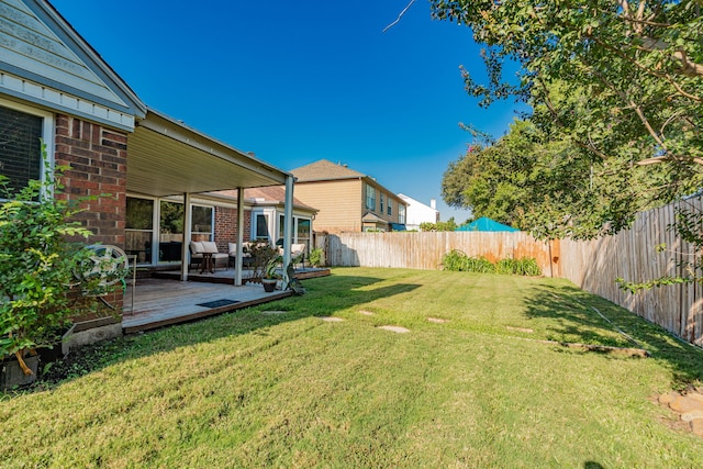 view of yard with a wooden deck