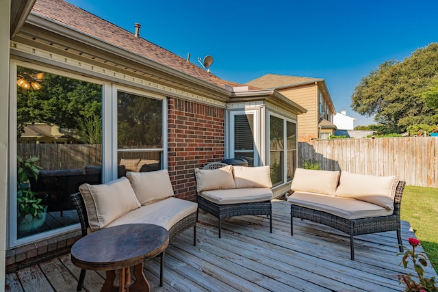 wooden terrace with outdoor lounge area