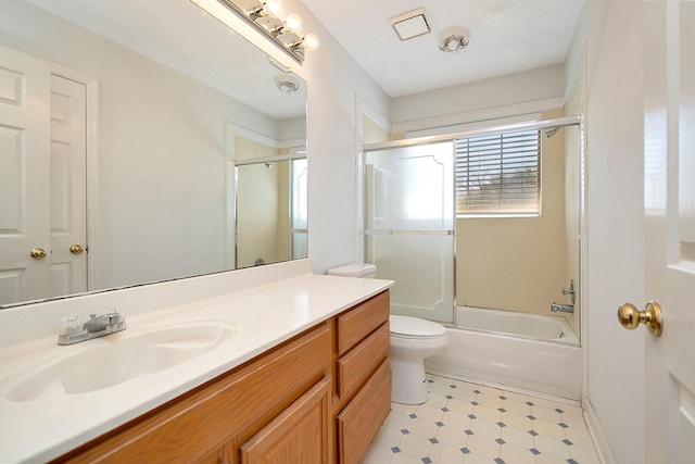 full bathroom with toilet, combined bath / shower with glass door, and vanity