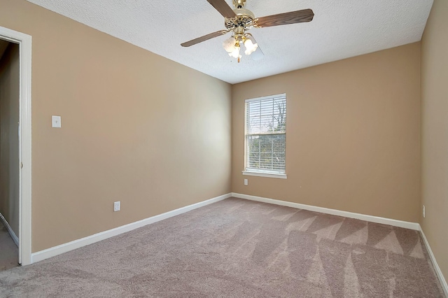 carpeted empty room with a textured ceiling and ceiling fan