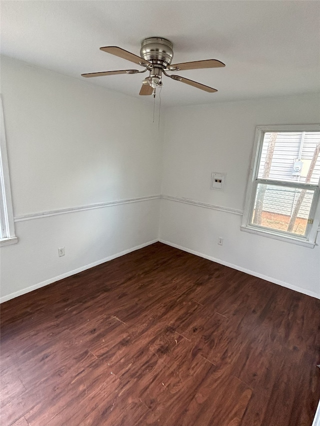 unfurnished room featuring dark hardwood / wood-style floors and ceiling fan