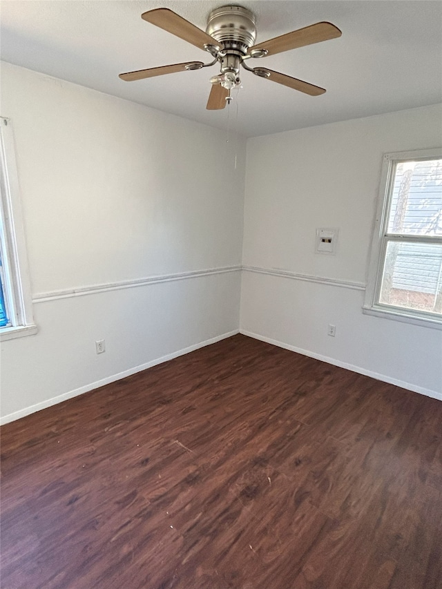 unfurnished room featuring ceiling fan and dark hardwood / wood-style flooring