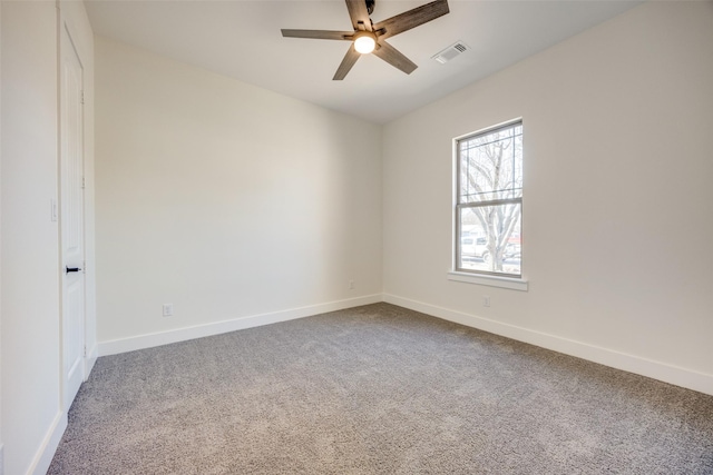 carpeted empty room with ceiling fan