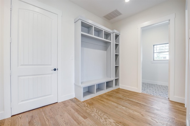 mudroom with light hardwood / wood-style flooring