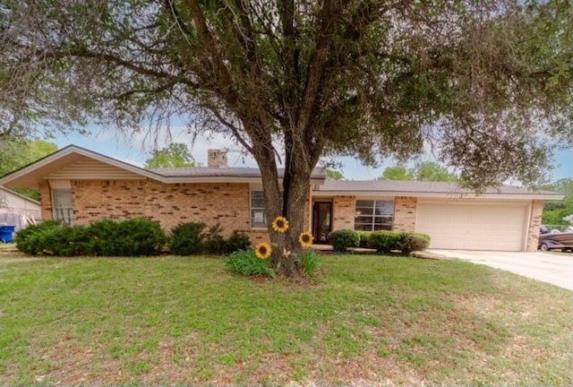 ranch-style house with a garage and a front lawn