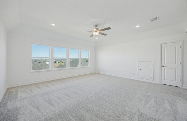 unfurnished room featuring ceiling fan and light colored carpet