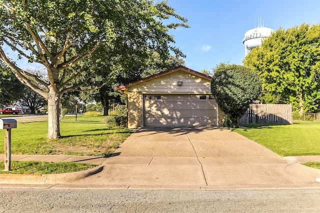 view of front of house with a front lawn and a garage