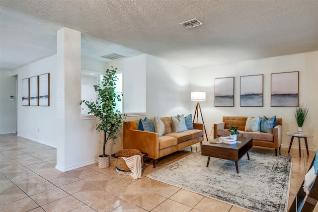 tiled living room with a textured ceiling