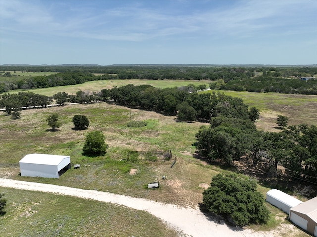 birds eye view of property featuring a rural view