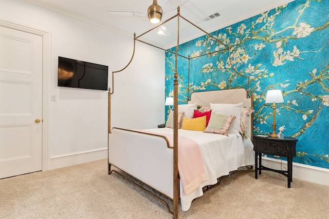 bedroom with crown molding, carpet flooring, and ceiling fan