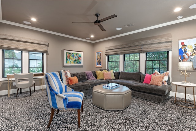 carpeted living room featuring ornamental molding, a healthy amount of sunlight, and ceiling fan