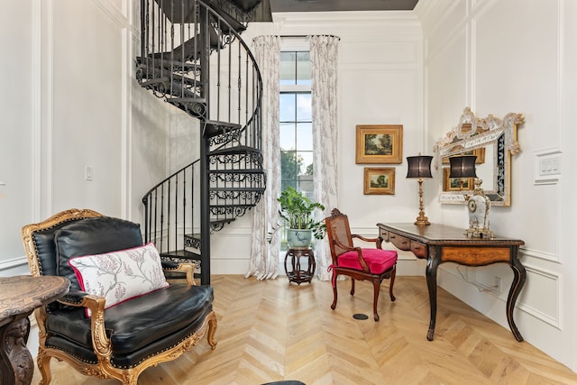 sitting room featuring light parquet floors