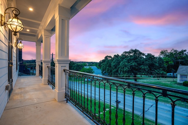 view of balcony at dusk