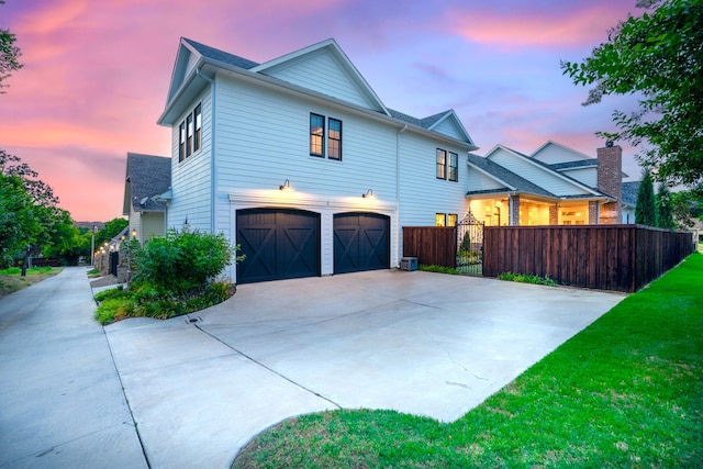 property exterior at dusk with a garage