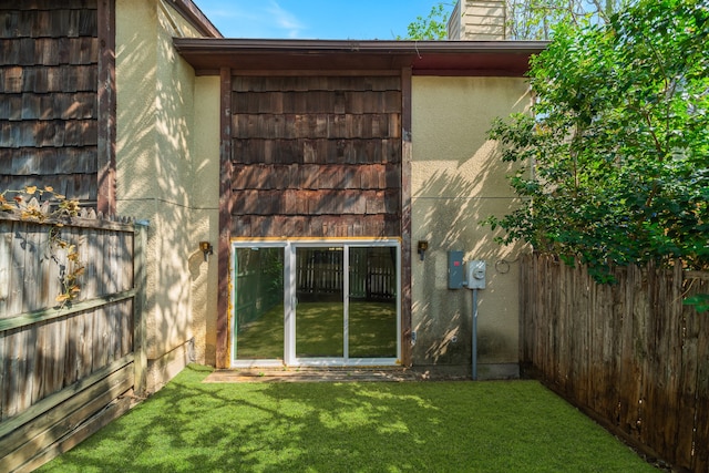 rear view of house with a lawn