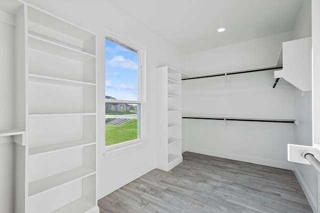 walk in closet featuring light hardwood / wood-style flooring