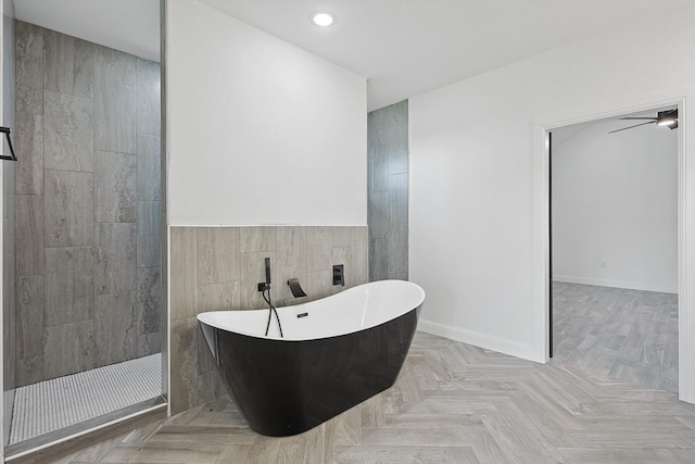 bathroom with ceiling fan, tile walls, independent shower and bath, and parquet floors