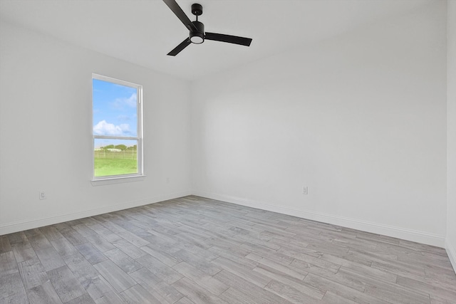 unfurnished room with light wood-type flooring and ceiling fan