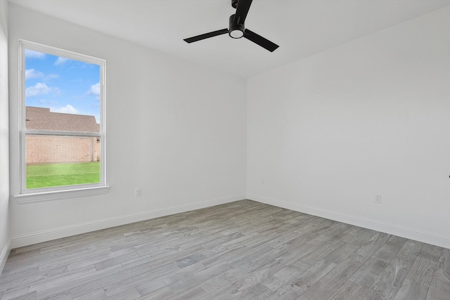 spare room featuring ceiling fan and light hardwood / wood-style floors