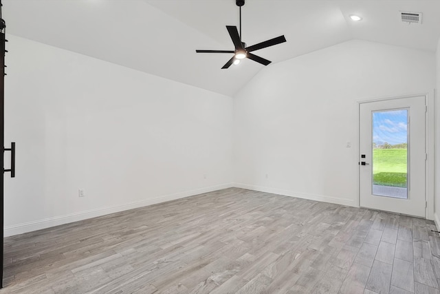 unfurnished living room featuring light wood-type flooring, ceiling fan, and vaulted ceiling