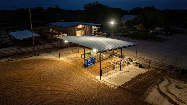 pool at twilight featuring an outdoor structure