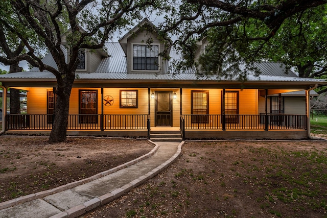 country-style home with covered porch