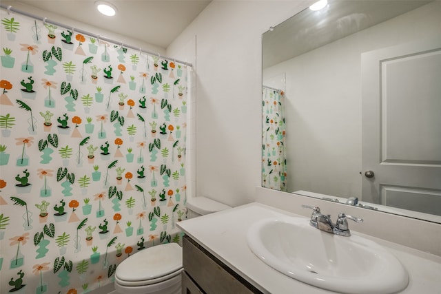 full bathroom featuring shower / bath combo, vanity, and toilet