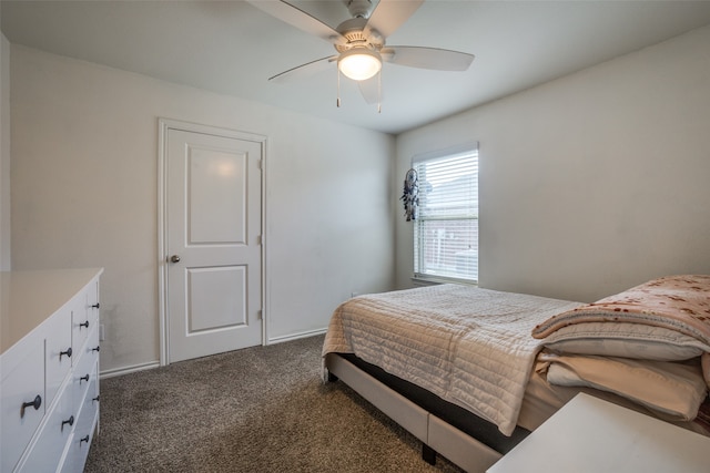 bedroom featuring dark carpet and ceiling fan