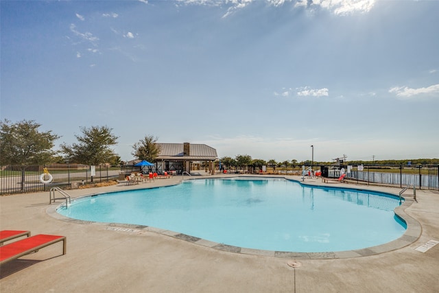 view of swimming pool with a patio