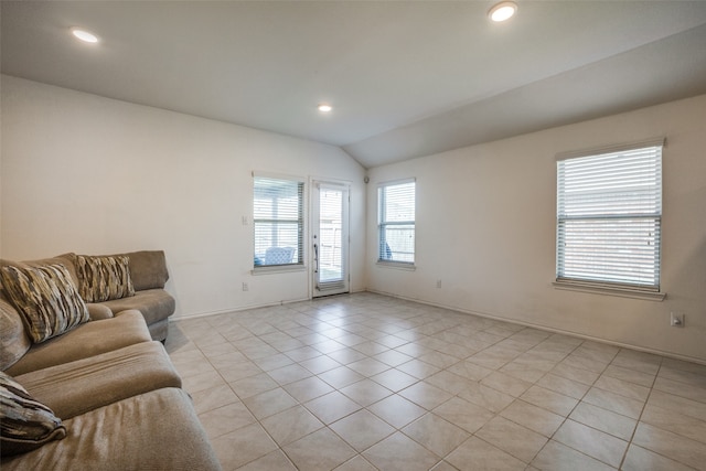 living room featuring light tile patterned flooring and lofted ceiling