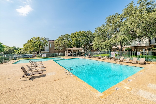 view of pool featuring a patio area