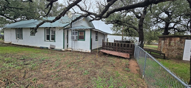 view of side of home featuring a wooden deck