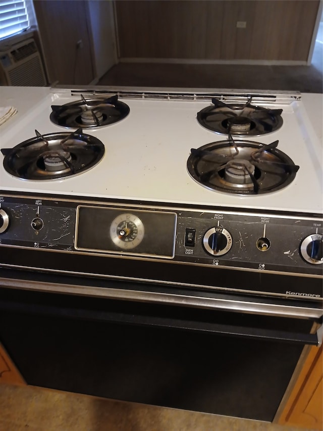 room details featuring black stove and cooling unit