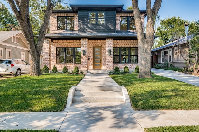 view of front of property with a front lawn