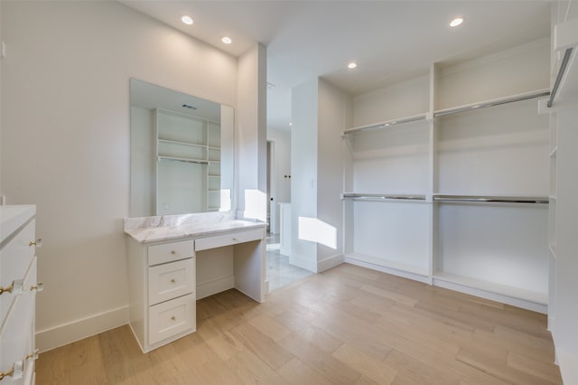 bathroom with hardwood / wood-style floors and vanity