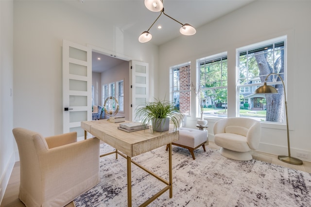 living area with built in features and hardwood / wood-style floors