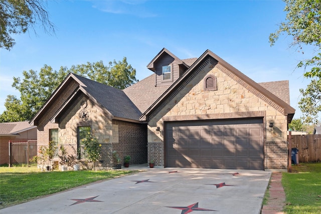 view of front of home featuring a garage and a front lawn