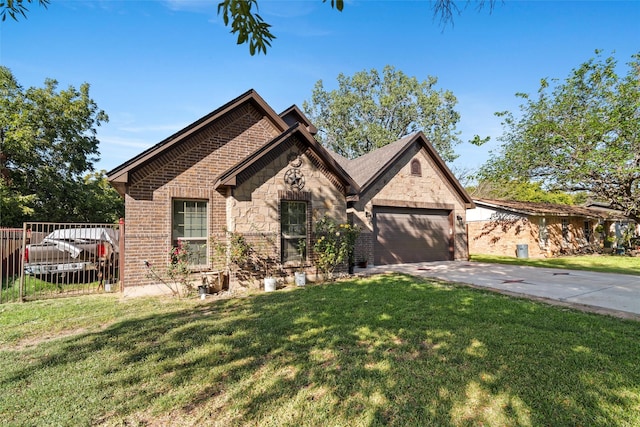 view of front of property with a garage and a front yard